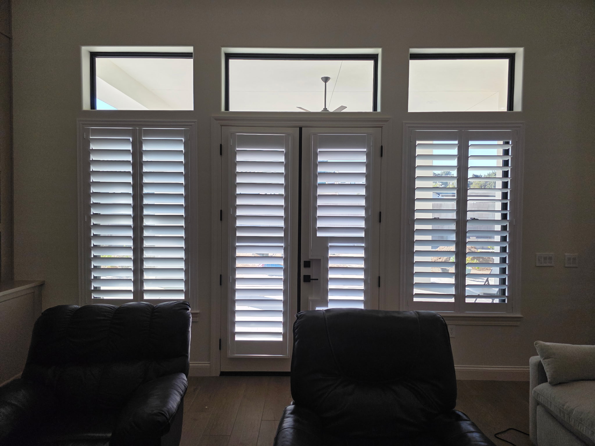 Plantation shutters installed on French doors in a Bakersfield home