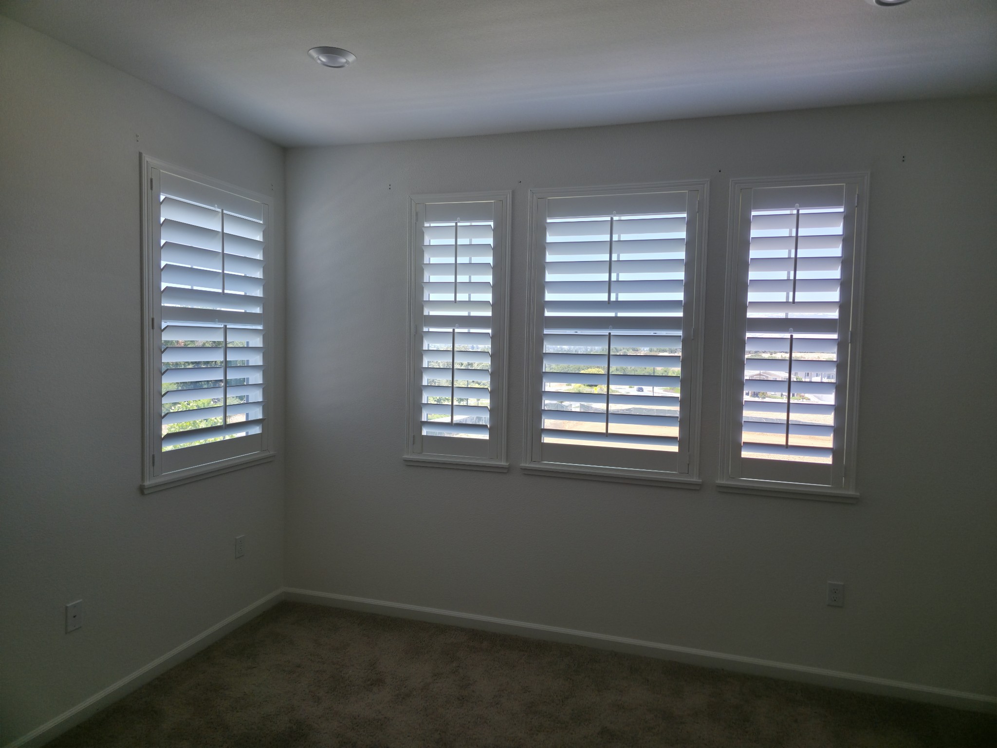 Motorized shutter system installed in living room
